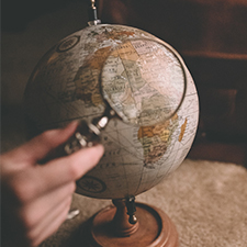 Searching the globe with magnifying glass